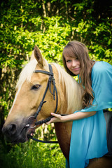 Fototapeta premium beautiful young girl with a horse 