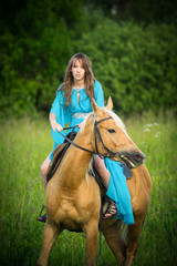 beautiful young girl with a horse

