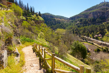 Fototapeta na wymiar Path with wooden railing in the countryside, in the city of Cuena, Spain