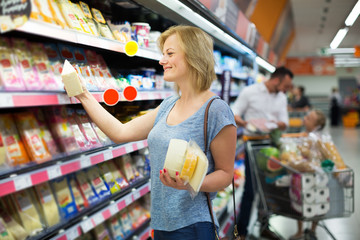 Woman holding variety of cheese