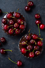 red cherry in a homemade chocolate tart.
