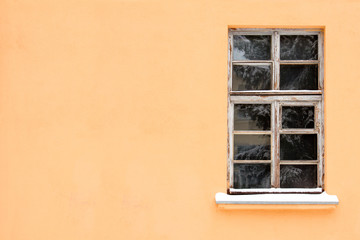 Orange wall with one old window