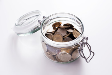 Coins in glass money jar