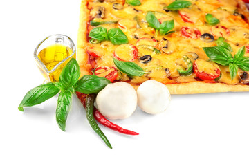 Delicious pizza with ingredients on white background
