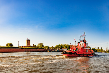 Tugboat entering to port of Gdansk, Poland.