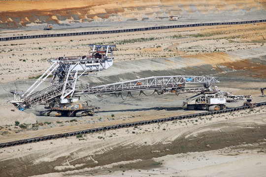 Giant excavator working on opet pit coal mine