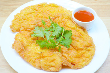 Omelet with chopped shrimp .