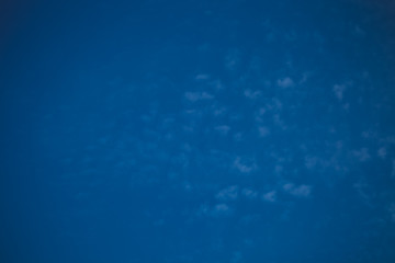 Fototapeta na wymiar White clouds on a blue sky. Selective focus. Toned