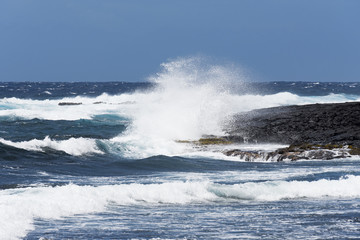 Lava coast and blue waters and white waves - Punalu'u Black Sand