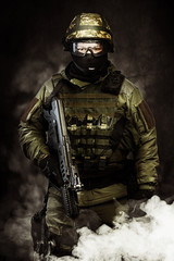 The man in the image of a member of the special forces with weap