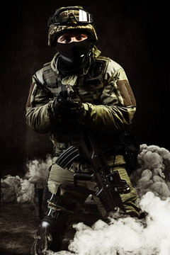 The man in the image of a member of the special forces with weap