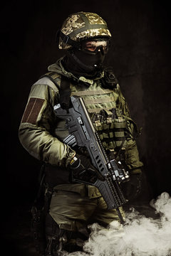 The man in the image of a member of the special forces with weap