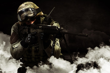 The man in the image of a member of the special forces with weap