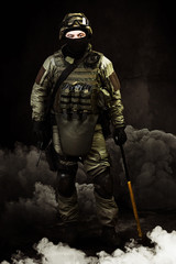 The man in the image of a member of the special forces with weap