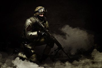 The man in the image of a member of the special forces with weap