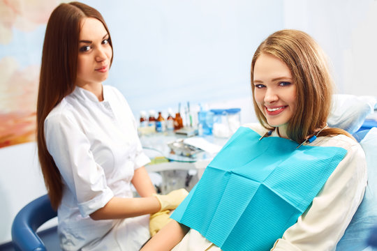 Overview of dental caries prevention.Woman at the dentist's chair during a dental procedure. Beautiful Woman smile close up. Healthy Smile. Beautiful Female Smile


