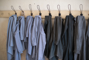 Old school aprons on coat racks
