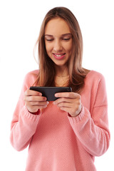 Fototapeta premium Portrait of teenager girl using smartphone over gray background
