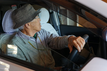 Senior person driving a car
