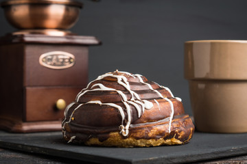Fresh bun on the rustic wooden background. Selective focus.