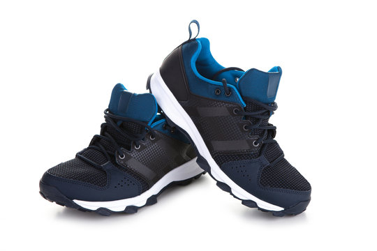 Pair of dark blue sport shoes on white background