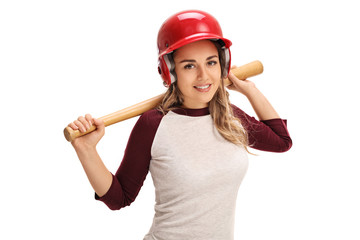 Happy young woman with a baseball bat and a helmet