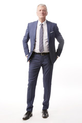 Senior businessman portrait.Full length shot of a senior professional man standing isolated white background.