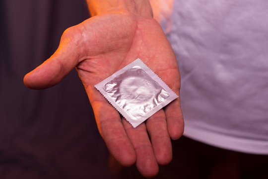 Condom in male hand. closeup
