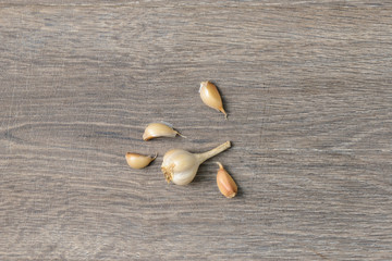 Garlic scattered on wooden table