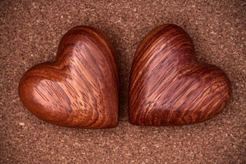 Two wooden hearts on rustic wood background. Valentines days con