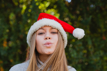 Happy young woman with Christmas hat