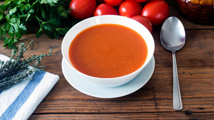 hot fresh homemade tomato soup with thyme, top view
