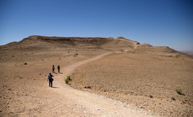 Hiking people in desert