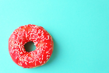 Delicious donut on color background