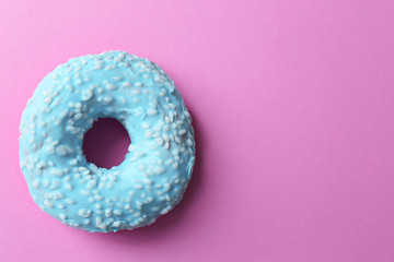 Delicious donut on pink background