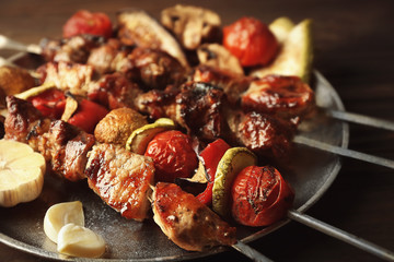 Fresh tasty barbecue with vegetables on tray, closeup