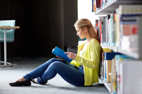 High School Student Girl Reading Book At Library