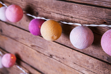 Cotton Christmas garland. Bright multi-colored decoration.