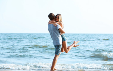 Happy couple on sea background