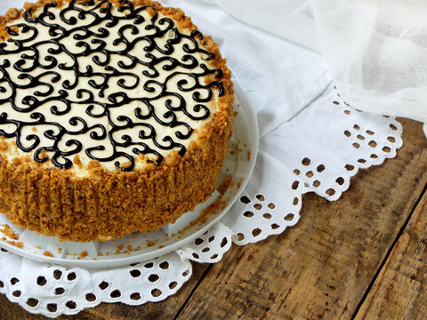 homemade cake with nut meringue butter cream and decorated with swirls of dark chocolate. Kyiv cake or cake Flight (Polet). copy space