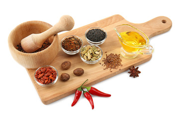 Composition with different spices and mortar on white background