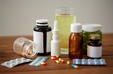 medicine and drugs on wooden table