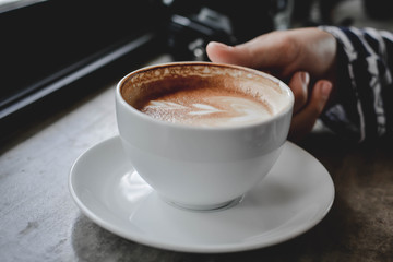 hot coffee latte art in coffee shop.selective