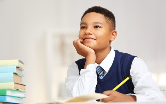 Cute boy at lesson in school