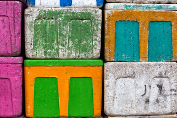 pile of bright colored styrofoam boxes at a fish market somewhere in indonesia