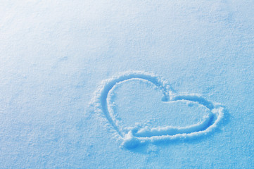 Heart on snow. Concept of Christmas and Valentine's Day