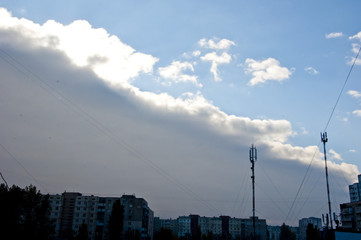 rainy cloud above houses with antenna