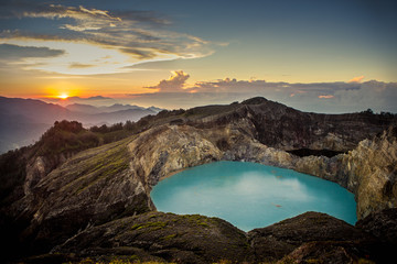 Sunrise on top of the Kelimutu volcano at Flores, Indonesia. On the front you can see the beautiful...