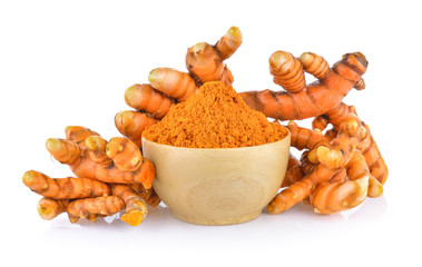 turmeric root and dry tumeric in wood bowl on white background