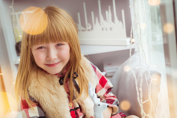 Portrait of little girl smiles in Christmas time